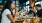 a group of people eating at a restaurant