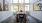 a spacious room with a table and chairs