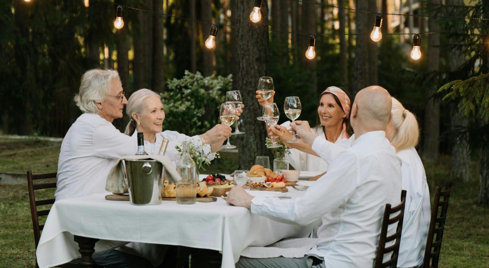 Bustling community with plenty of dining choices a group of people sitting at a table with food