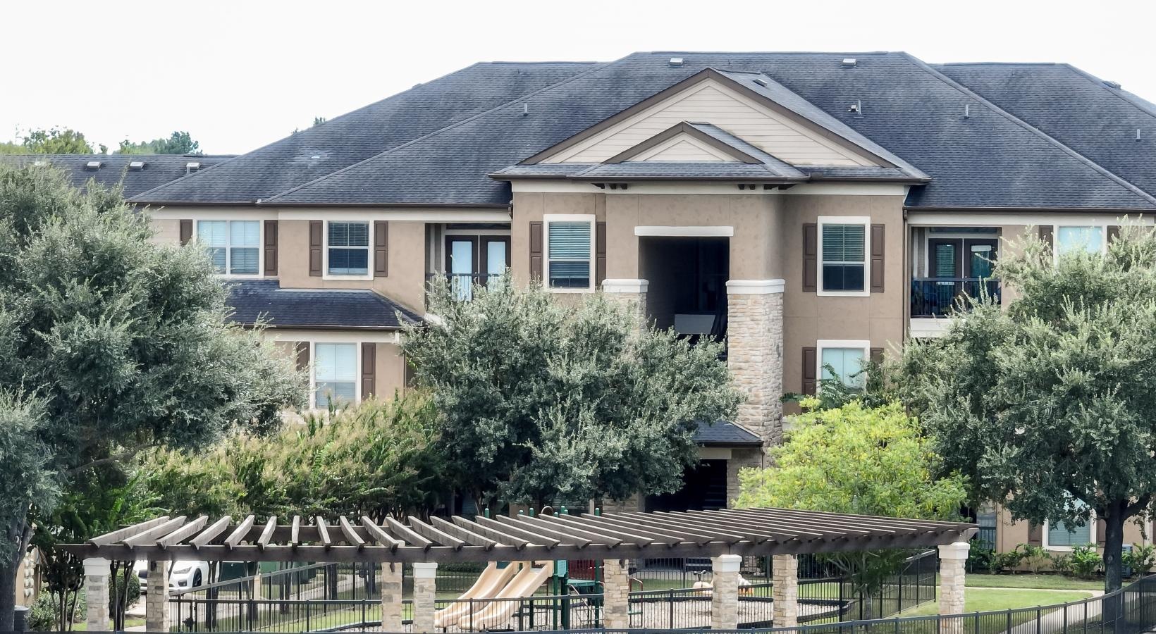 The essence of exceptional living a building with a fence around it