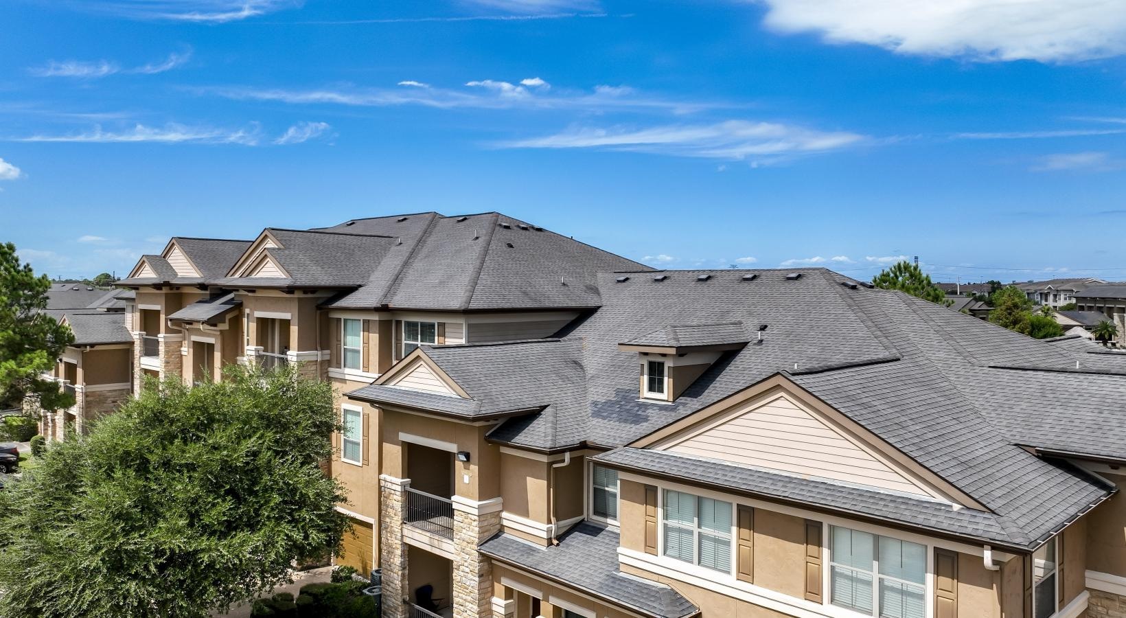 Find your perfect fit at The Falls at Copper Lake a large building with a parking lot