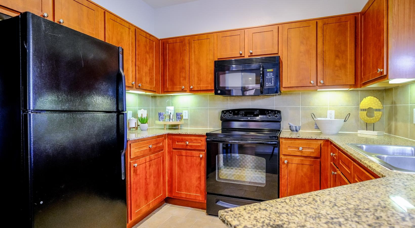 Beautiful kitchens with designer finishes a kitchen with wooden cabinets