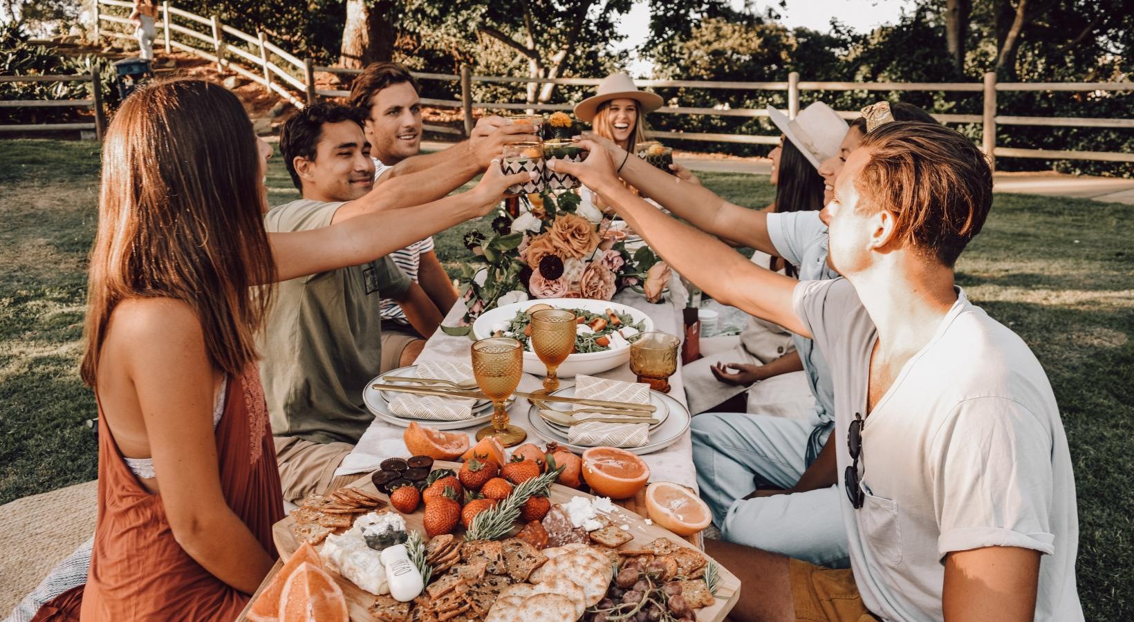 Vibrant community life with a variety of dining options a group of people around a table with food on it