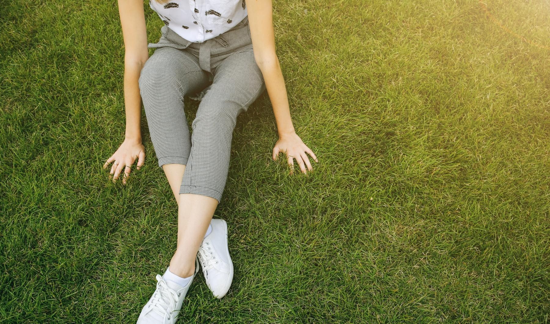 a person sitting on grass