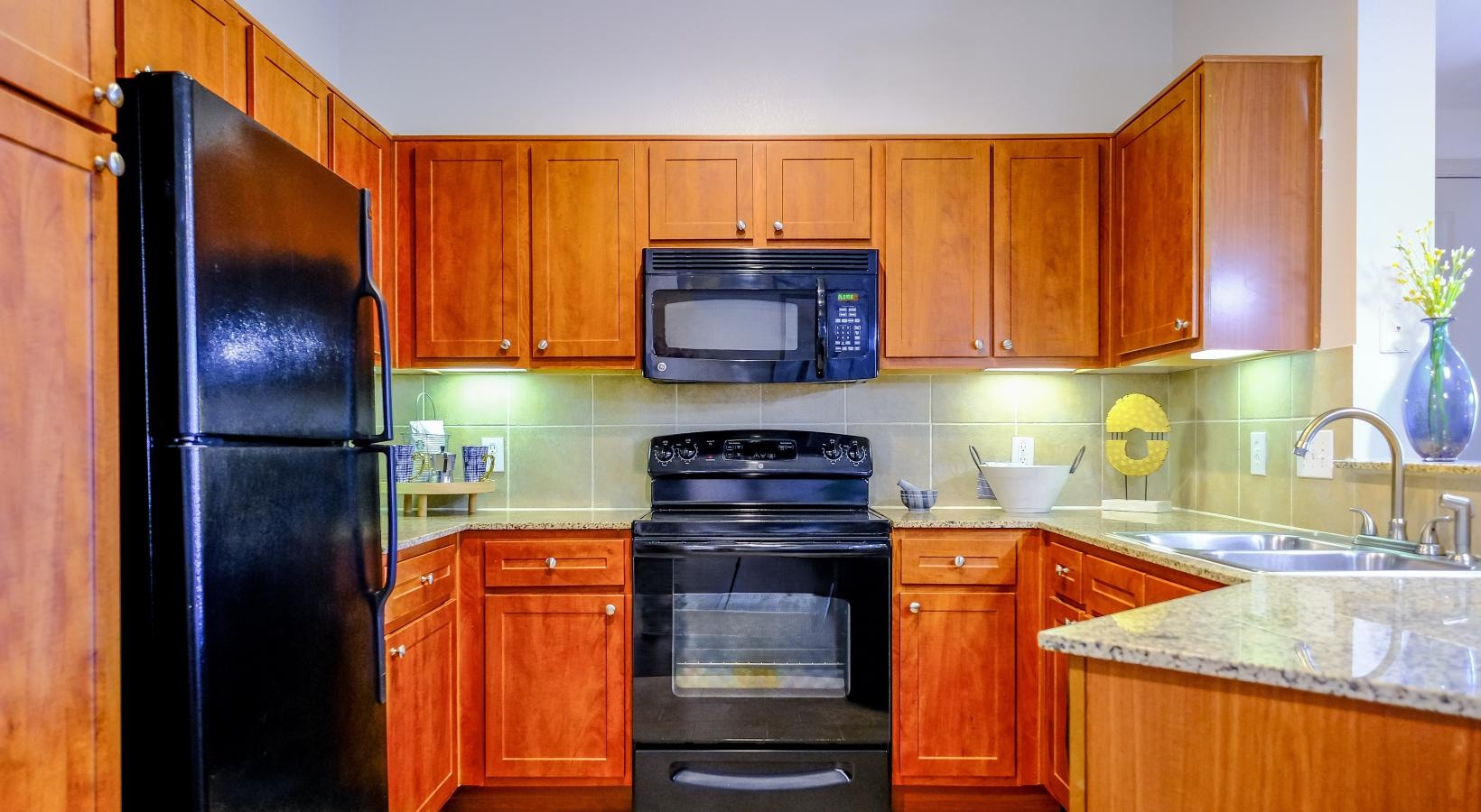 Spacious kitchens with thoughtful details a kitchen with wooden cabinets