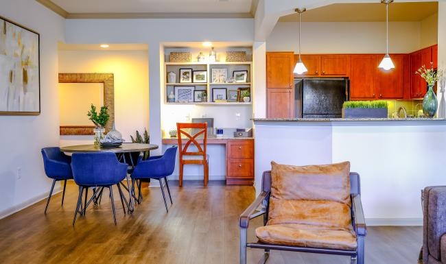 a kitchen with a dining table and chairs