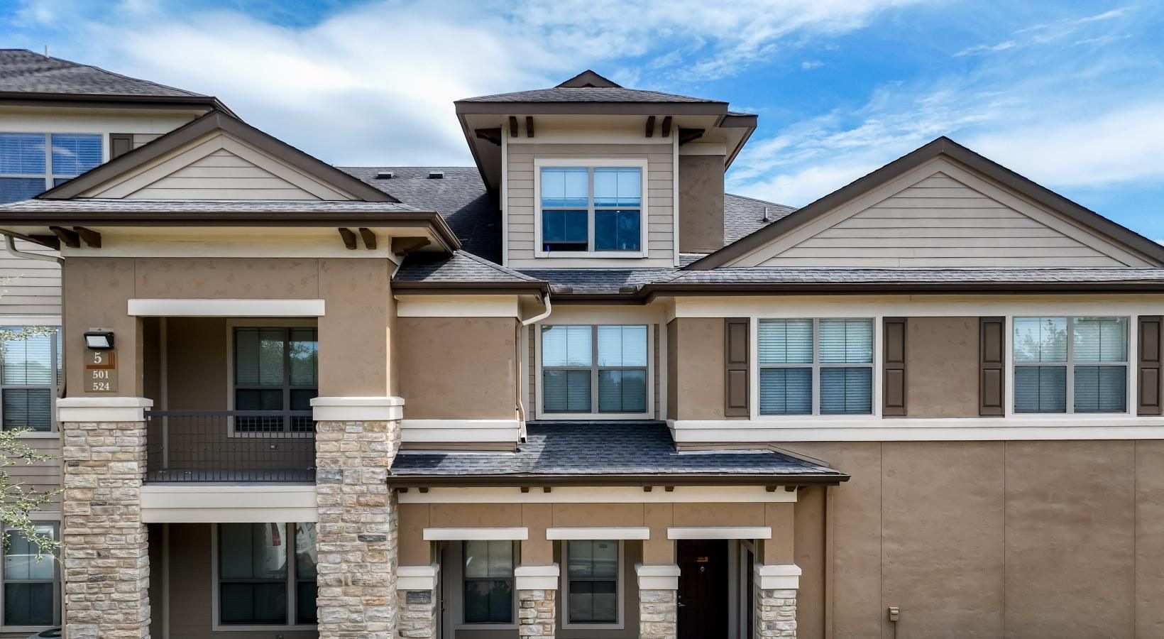 Settle into comfort at The Falls at Copper Lake a large building with a green lawn