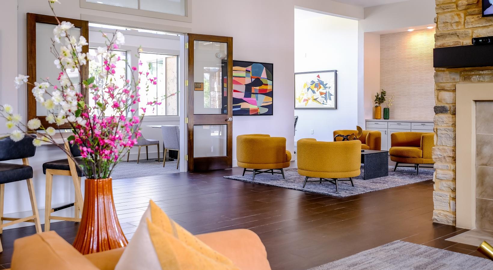 Find your perfect fit at The Falls at Copper Lake a spacious room with large yellow chairs