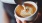a person pouring a cup of coffee