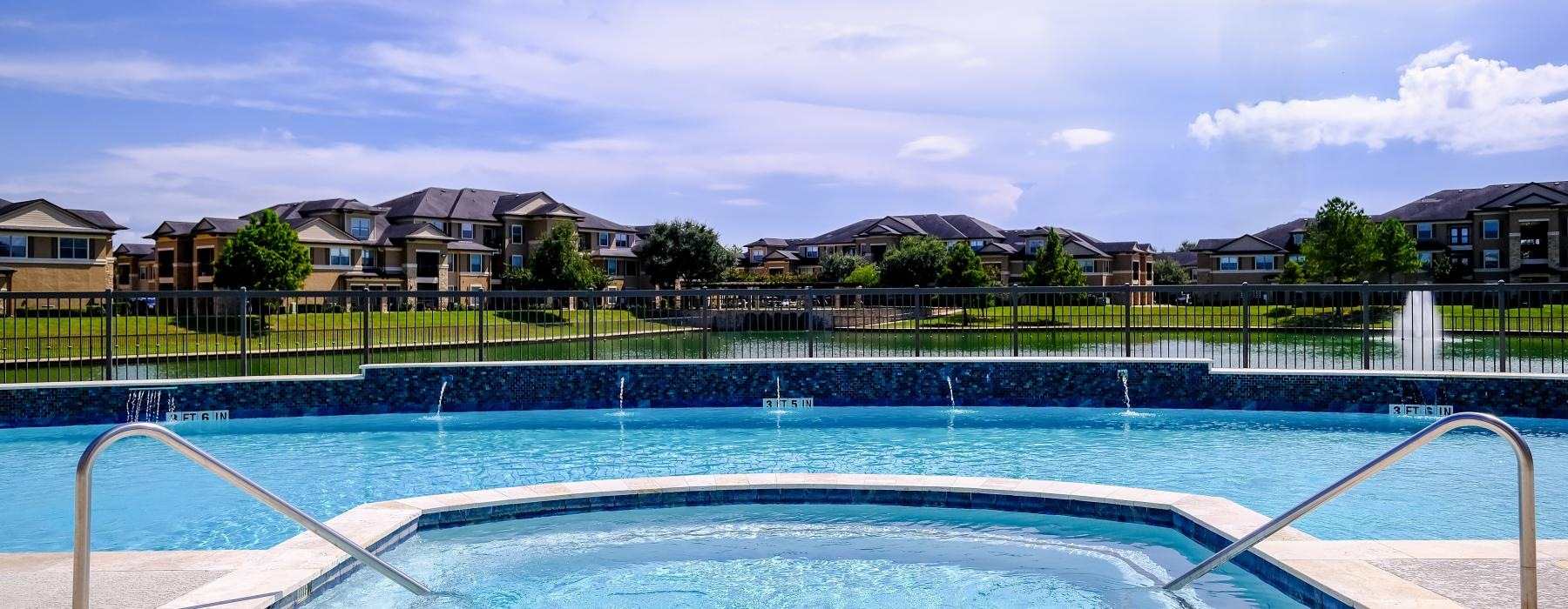 a swimming pool with a fence around it